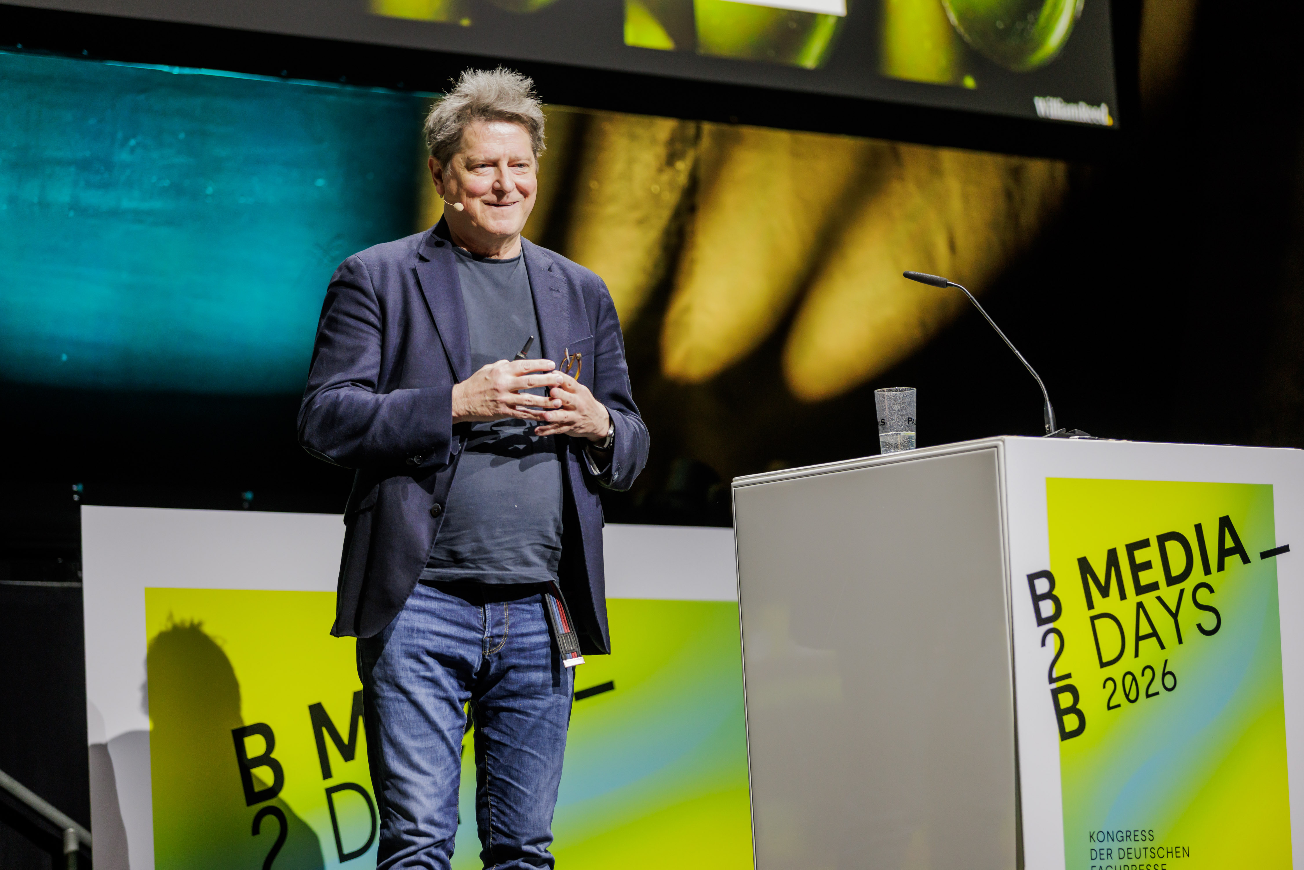 Photo of John Barnes, Caption: John Barnes, Chief Digital Officer at William Reed, delivers the keynote address at B2B Media Days 2026 in Berlin. Photo by © Monique Wüstenhagen